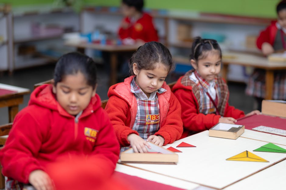 Young children engaged in learning with educational tools in a Montessori classroom setting
