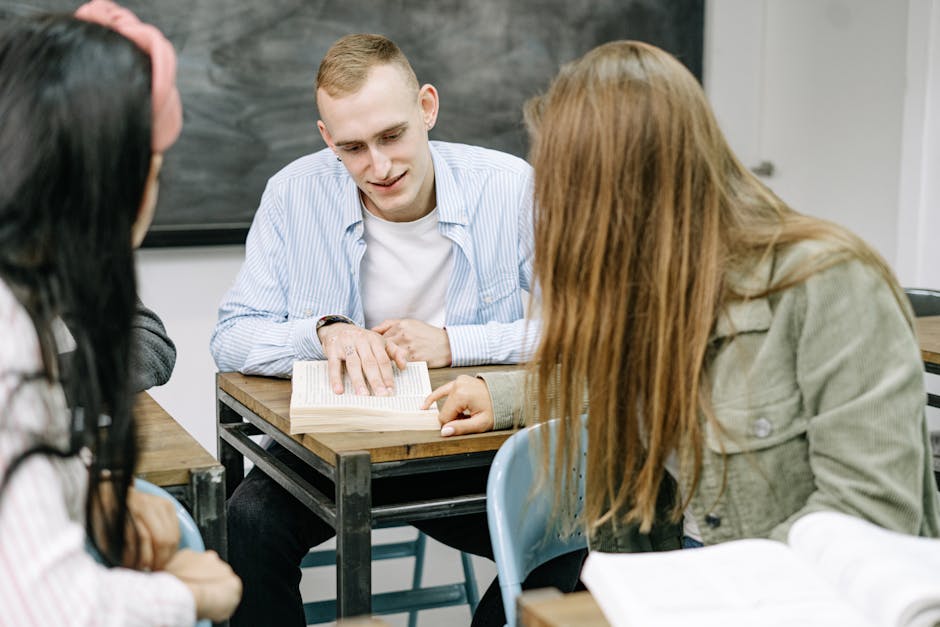 Group of students engaged in collaborative study session inside a classroom.